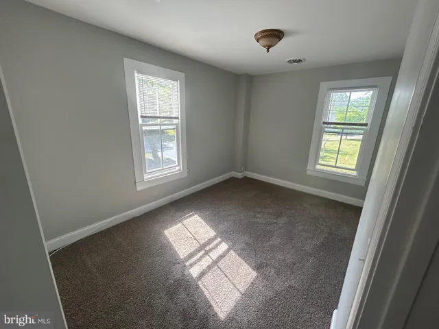 a view of an empty room and window