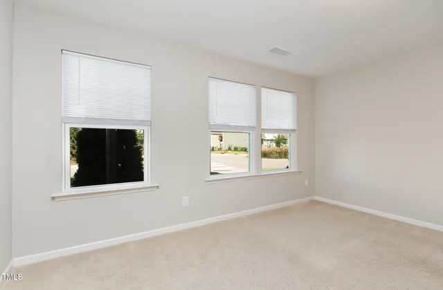a view of balcony with wooden floor and fence