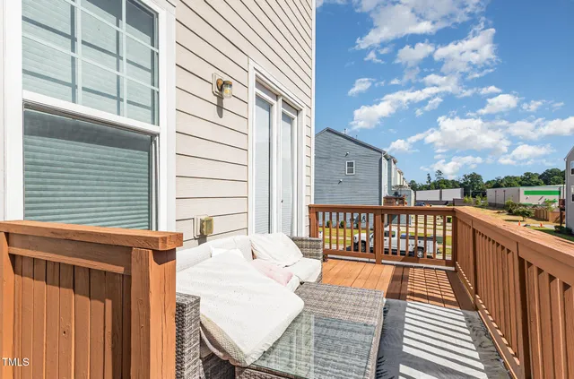 a swimming pool view with a seating space