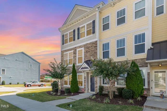 an aerial view of residential houses and outdoor space