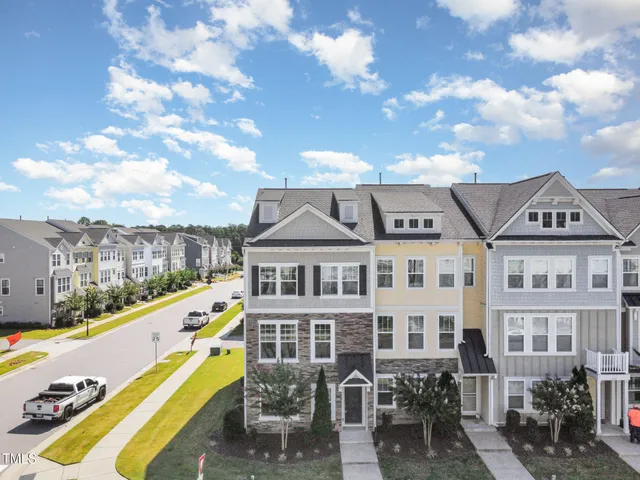 an aerial view of residential building with lake view