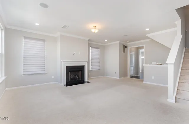 an empty room with windows and pillars in it