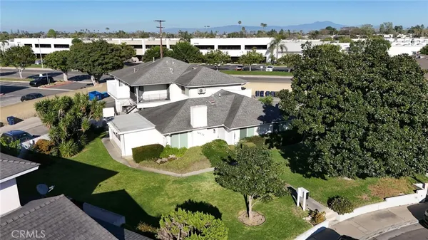 an aerial view of a house with yard swimming pool and outdoor seating