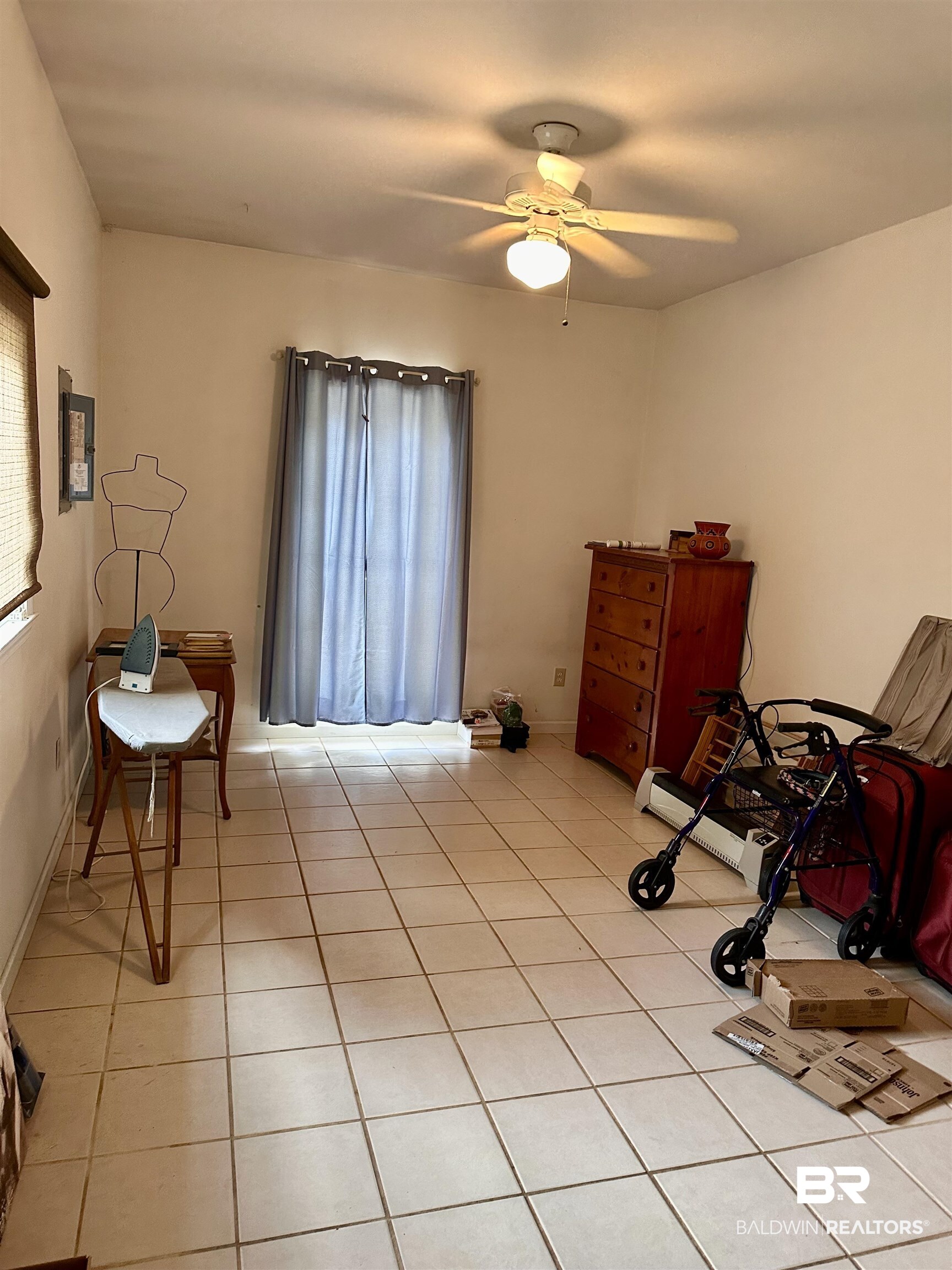 9101 Coronada Road Elberta, AL 36530 - Photo 10 of 27 Sitting room with light tile patterned flooring, a ceiling fan, and baseboard heating