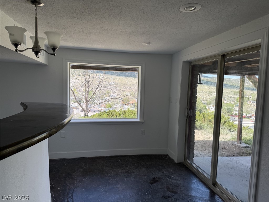 1 Carson Court Ely, NV 89301 - Photo 15 of 20 This interior space offers a scenic view of the surrounding landscape, connecting the indoors with natural beauty.