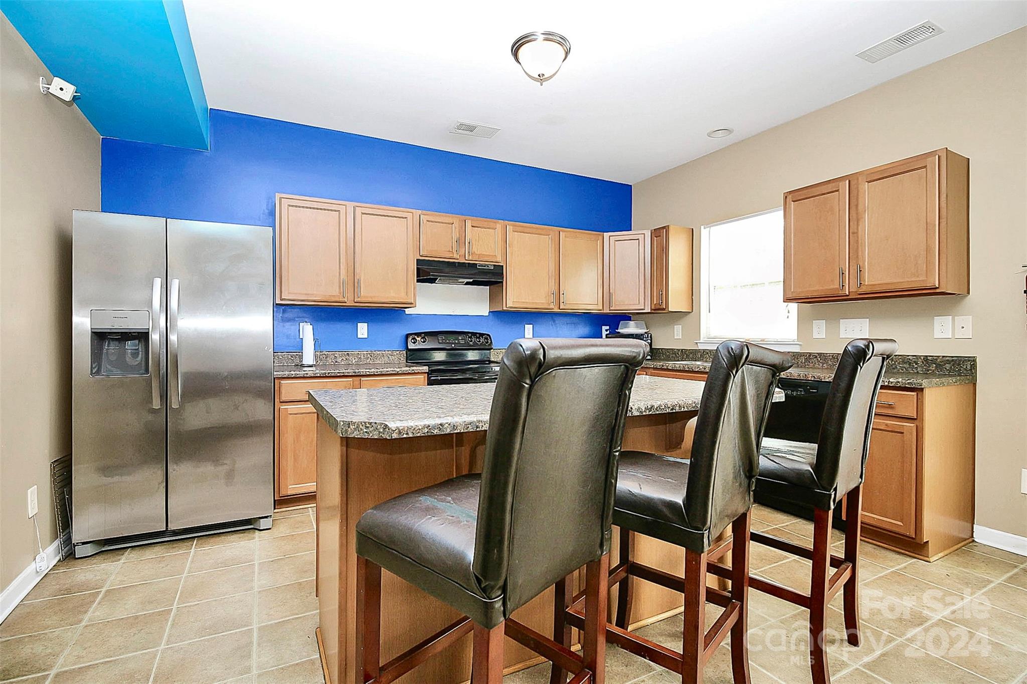 3416 Ashley View Drive Charlotte, NC 28213 - Photo 11 of 28 a kitchen with stainless steel appliances granite countertop a refrigerator a stove a sink dishwasher with a dining table and chair