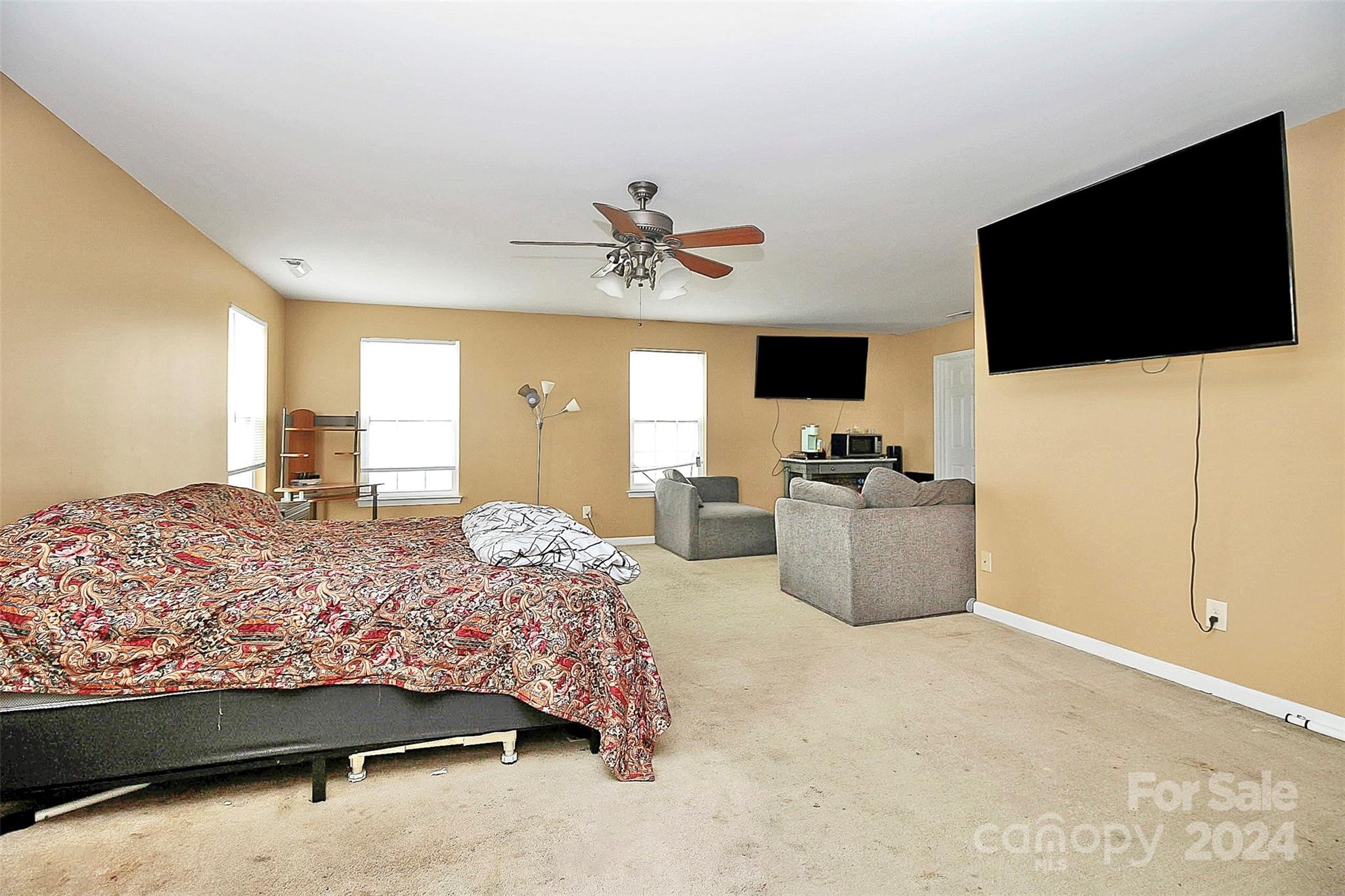 3416 Ashley View Drive Charlotte, NC 28213 - Photo 16 of 28 a bedroom with a bed and a flat screen tv