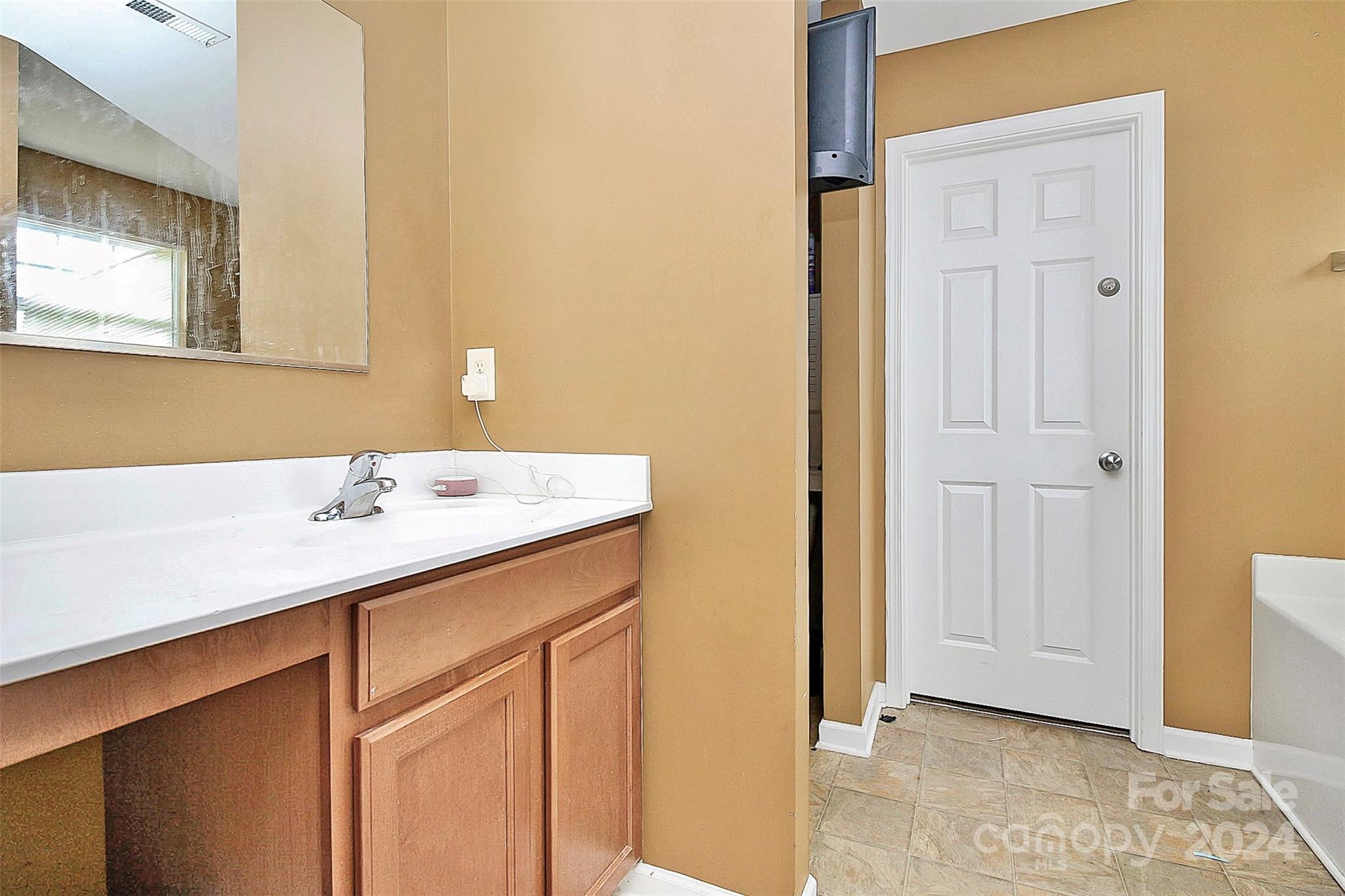 3416 Ashley View Drive Charlotte, NC 28213 - Photo 18 of 28 a bathroom with a sink and a mirror