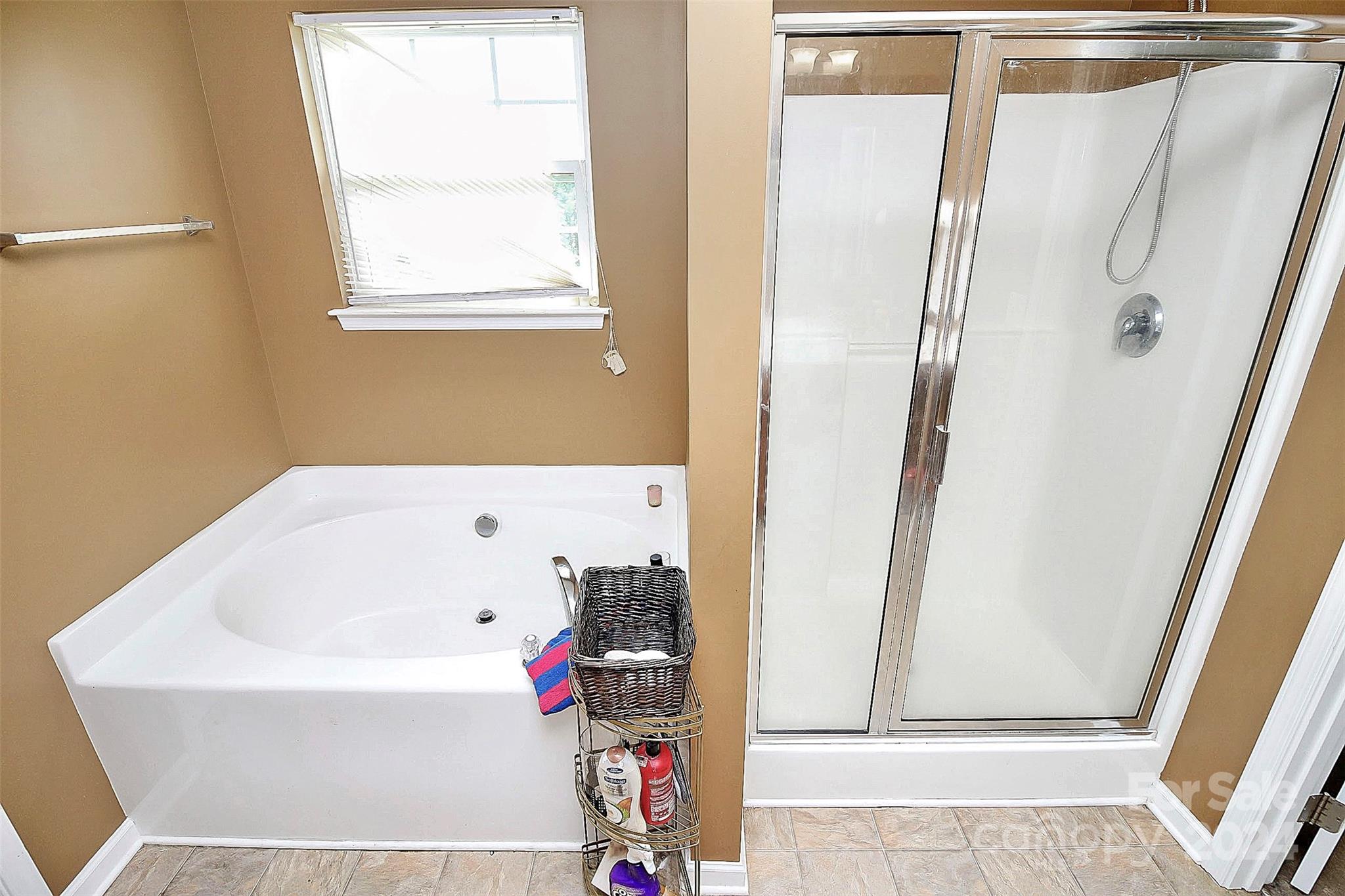 3416 Ashley View Drive Charlotte, NC 28213 - Photo 19 of 28 a bathroom with a bathtub and a shower
