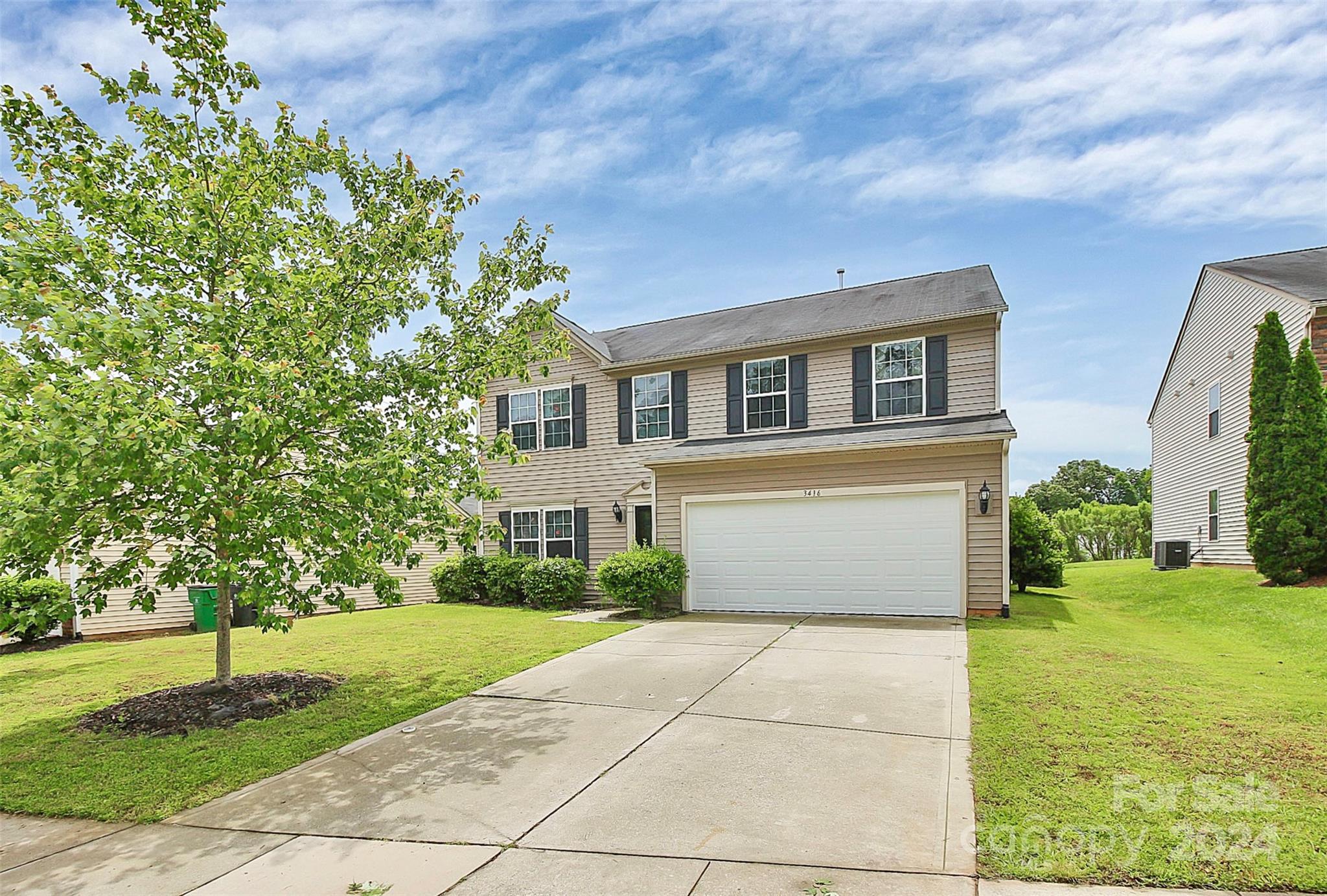 3416 Ashley View Drive Charlotte, NC 28213 - Photo 2 of 28 a front view of a house with a yard and trees
