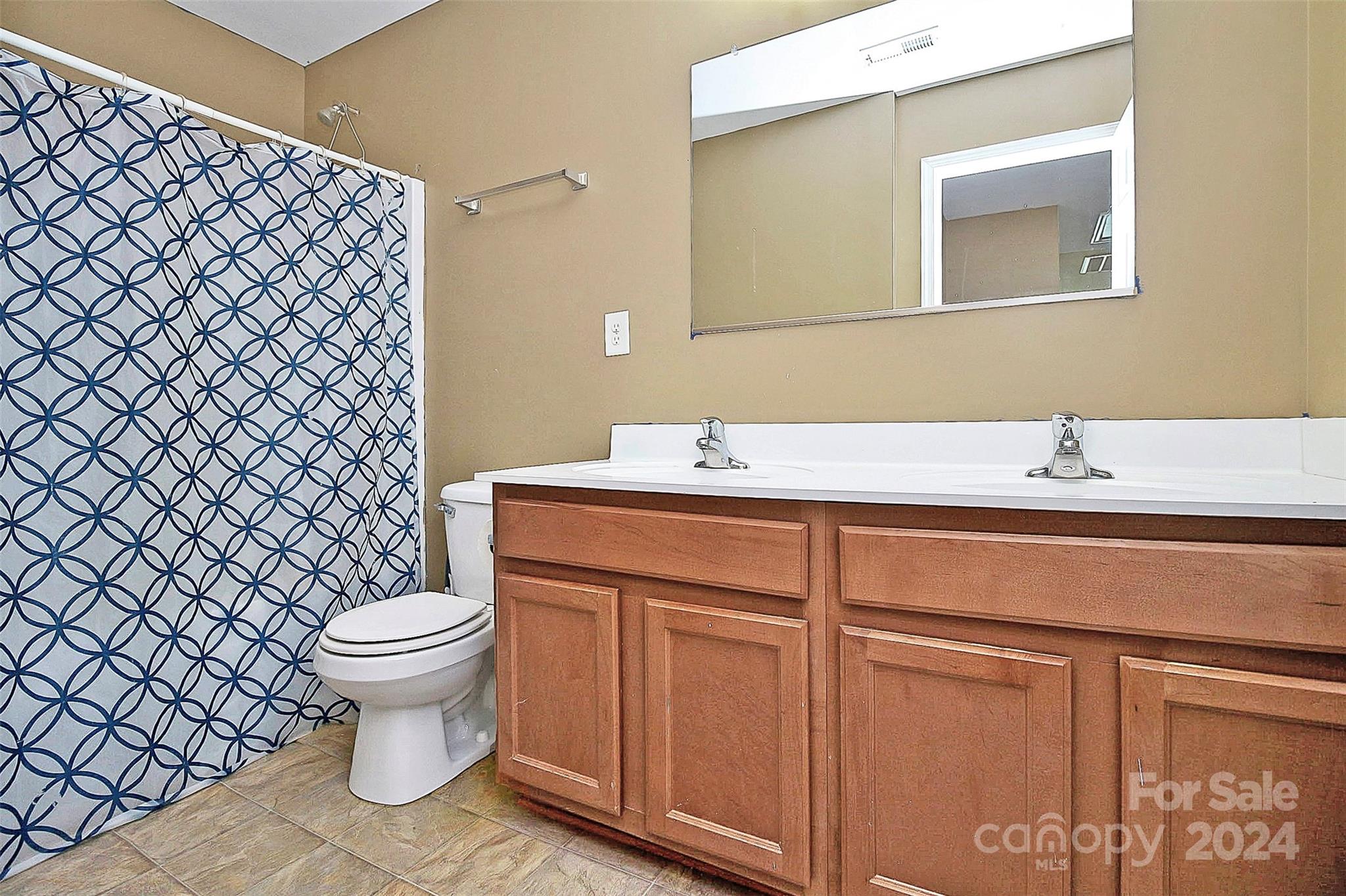 3416 Ashley View Drive Charlotte, NC 28213 - Photo 24 of 28 a bathroom with a sink toilet and a mirror