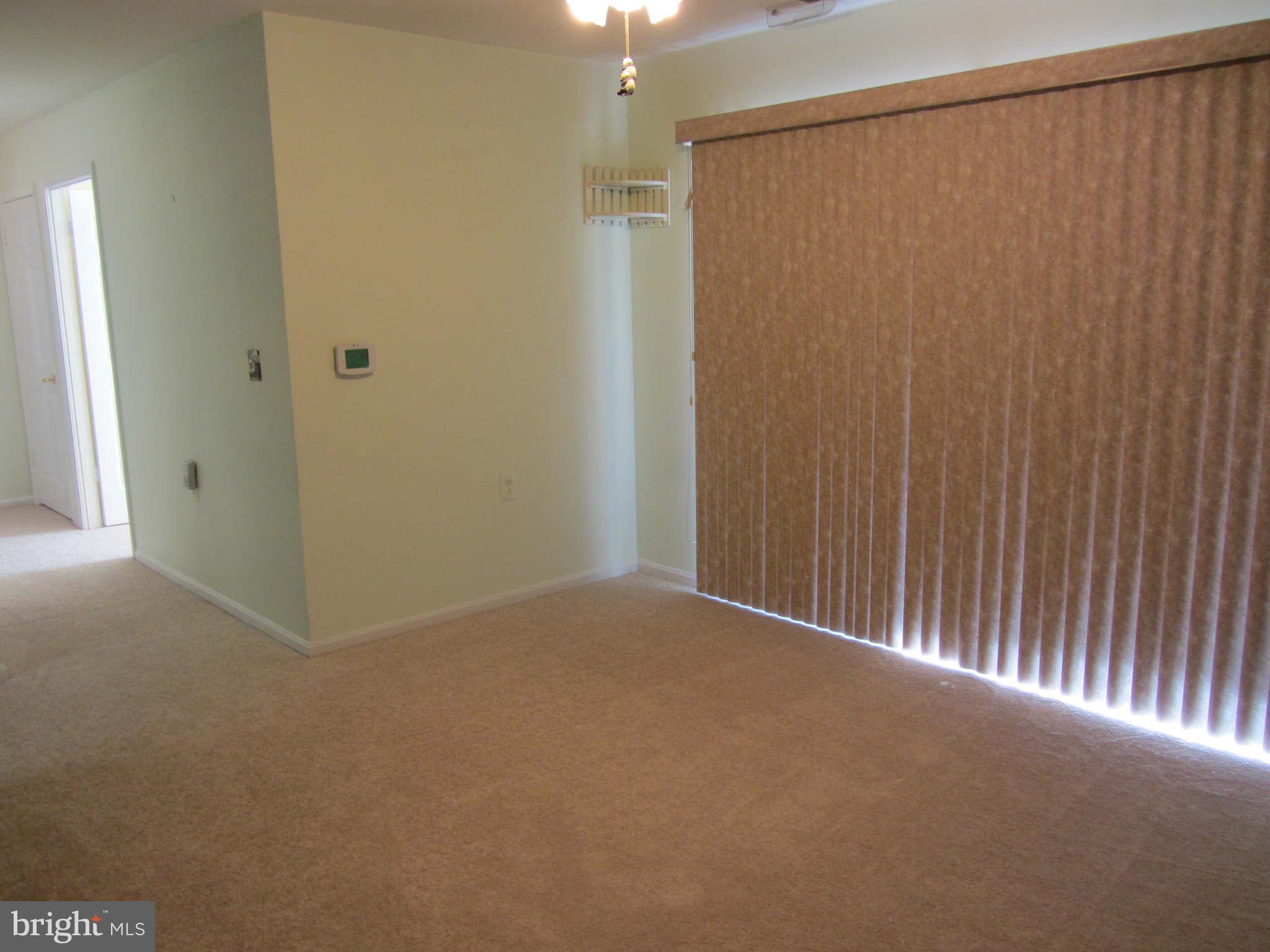 4100 Chardel Road, Unit 1C Baltimore, MD 21236 - Photo 7 of 26 Dining Room with Sliders to Balcony