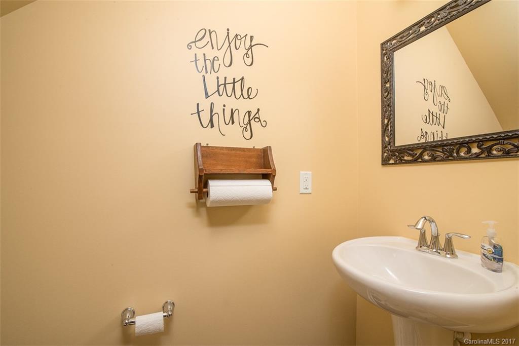 78123 Rillstone Drive Lancaster, SC 29720 - Photo 22 of 22 a bathroom with a sink and a mirror