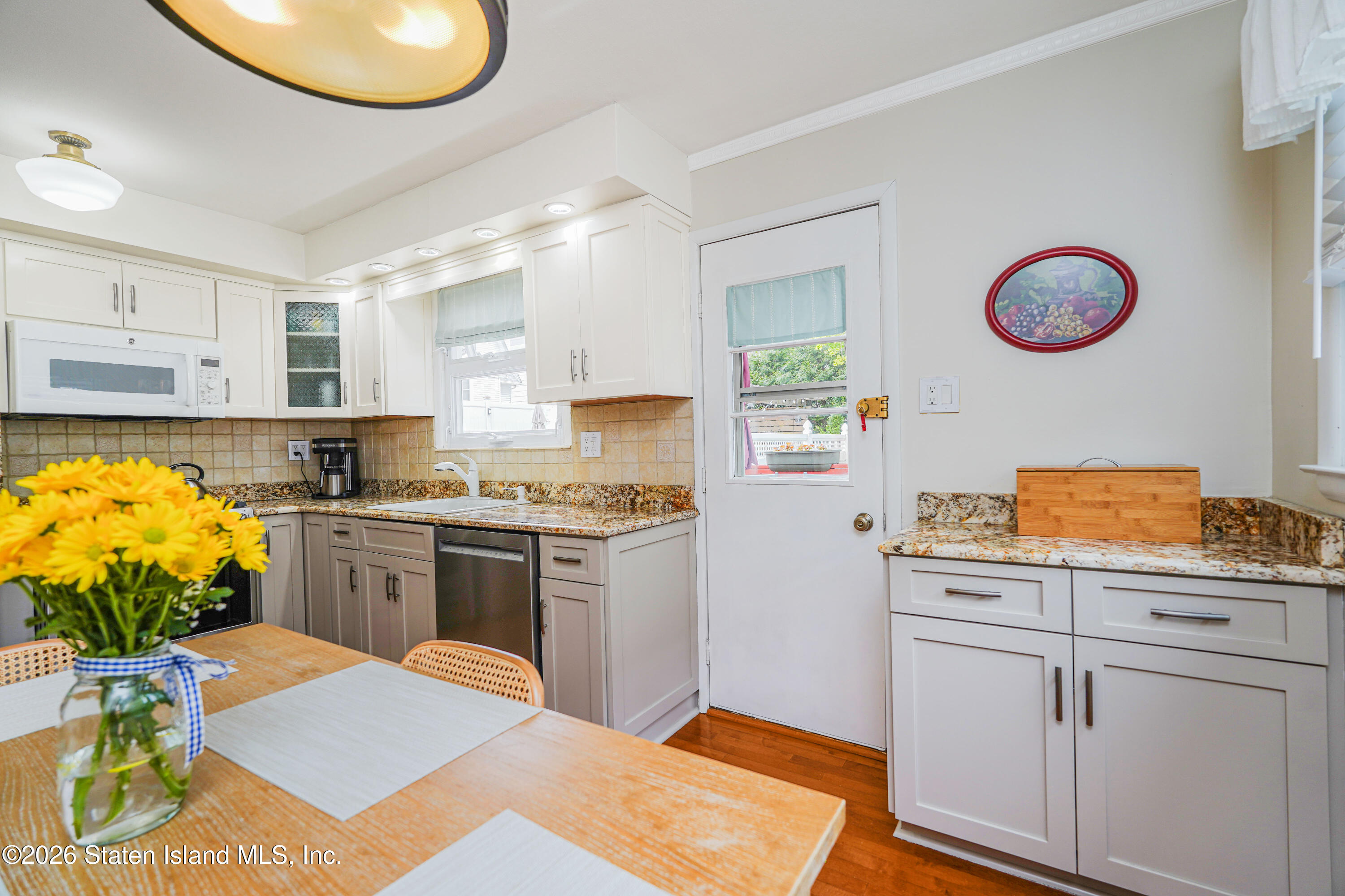 7750 Amboy Road Staten Island, NY 10307 - Photo 11 of 29 a kitchen with a sink cabinets and window