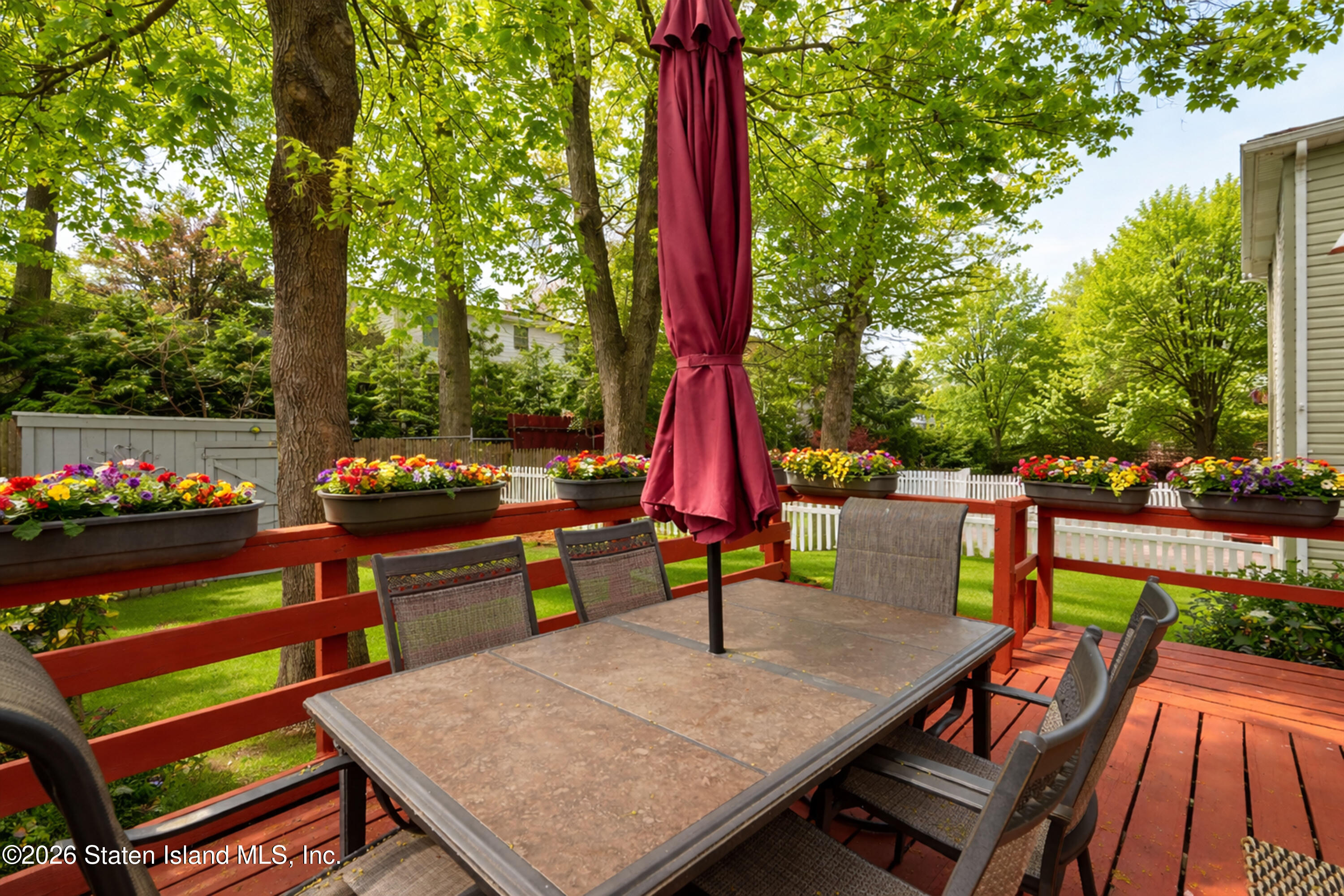 7750 Amboy Road Staten Island, NY 10307 - Photo 12 of 29 an outdoor sitting area with furniture and wooden deck