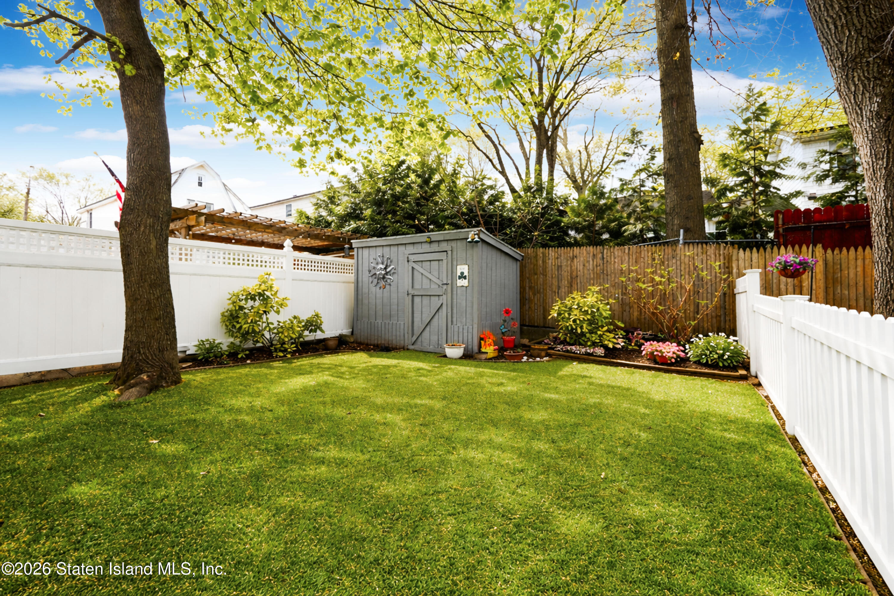 7750 Amboy Road Staten Island, NY 10307 - Photo 13 of 29 a view of a backyard with a garden