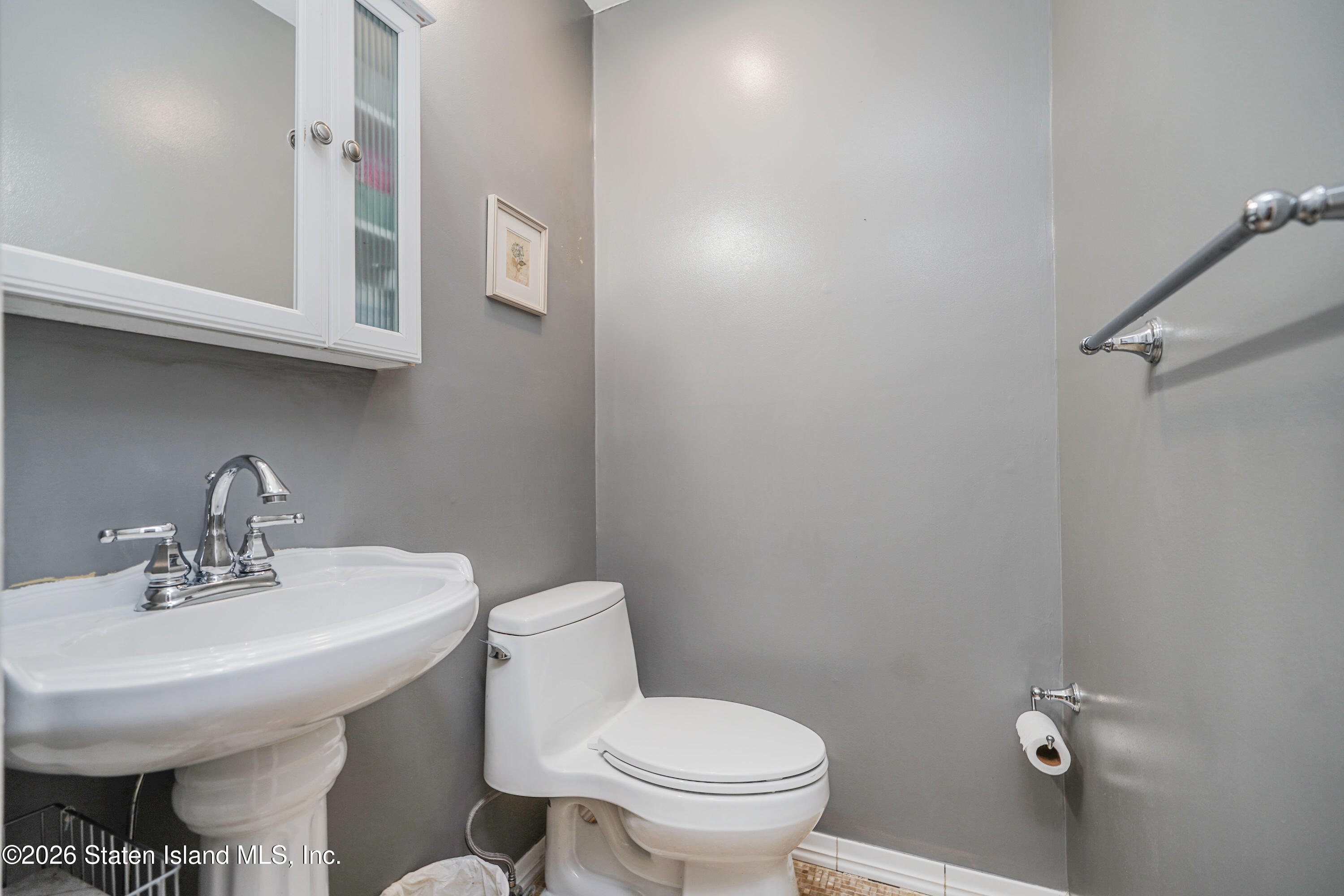 7750 Amboy Road Staten Island, NY 10307 - Photo 17 of 29 a bathroom with a sink and a toilet