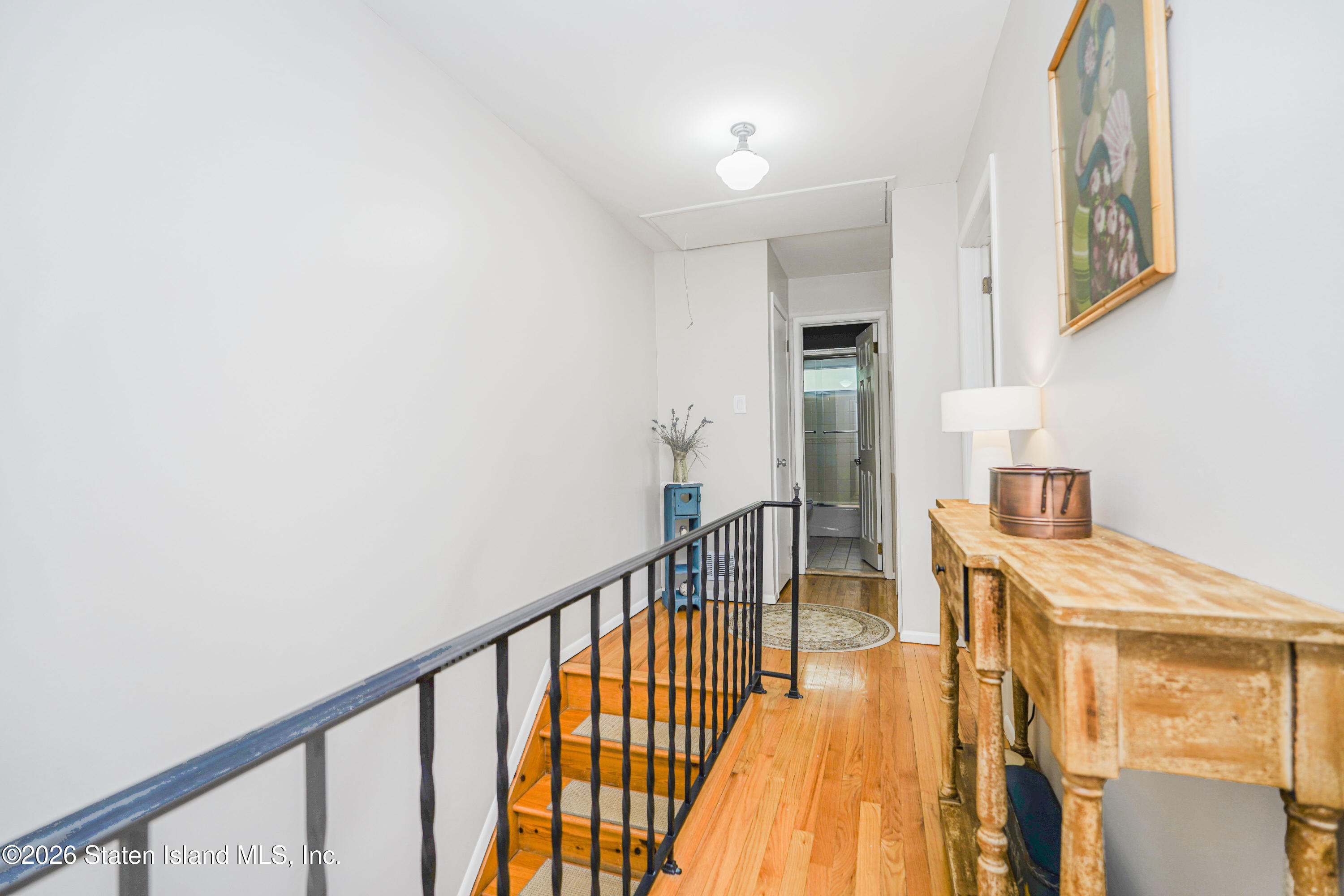 7750 Amboy Road Staten Island, NY 10307 - Photo 19 of 29 a view of a hallway with wooden floor and entryway