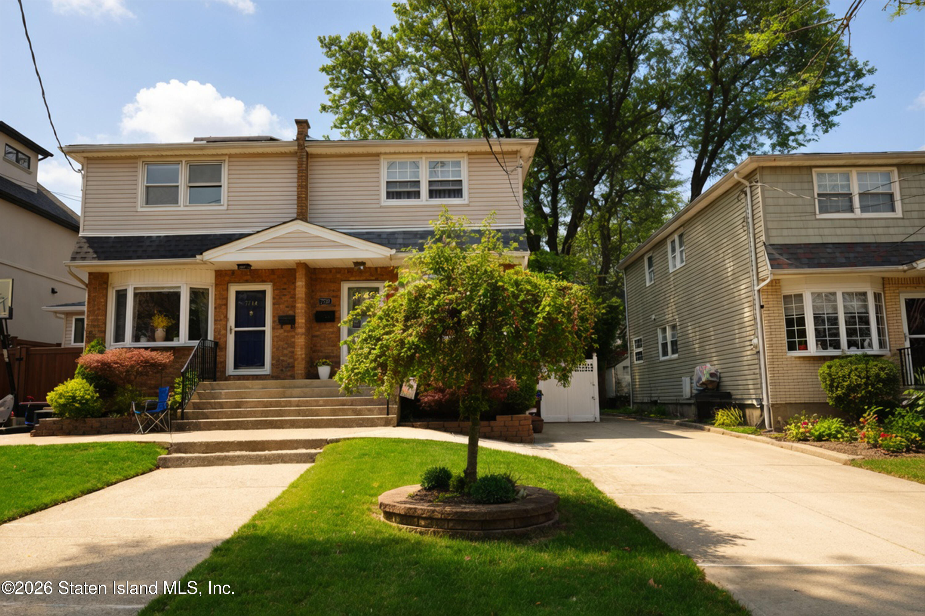 7750 Amboy Road Staten Island, NY 10307 - Photo 2 of 29 a front view of a house with a yard