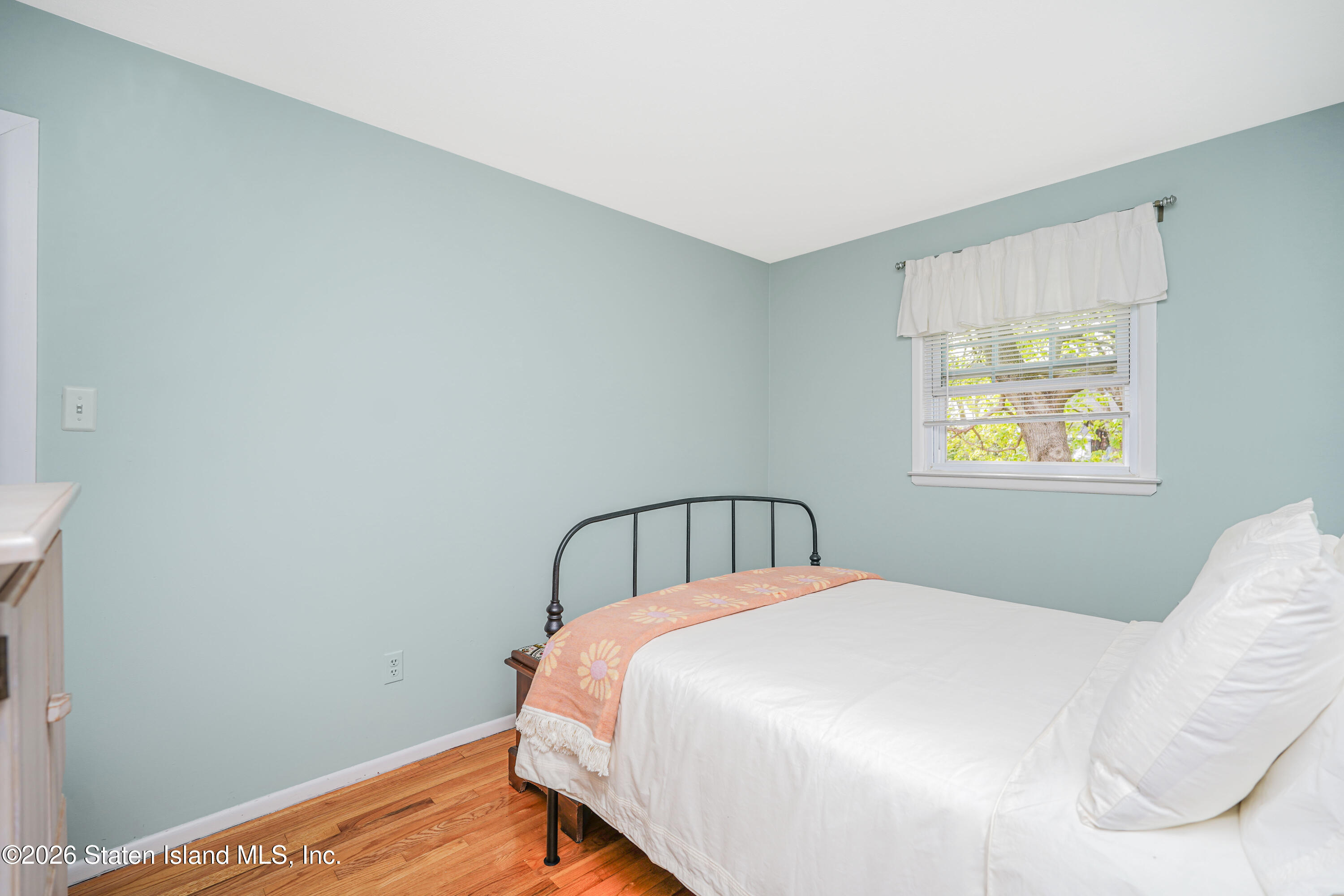 7750 Amboy Road Staten Island, NY 10307 - Photo 23 of 29 a bedroom with a bed and a window
