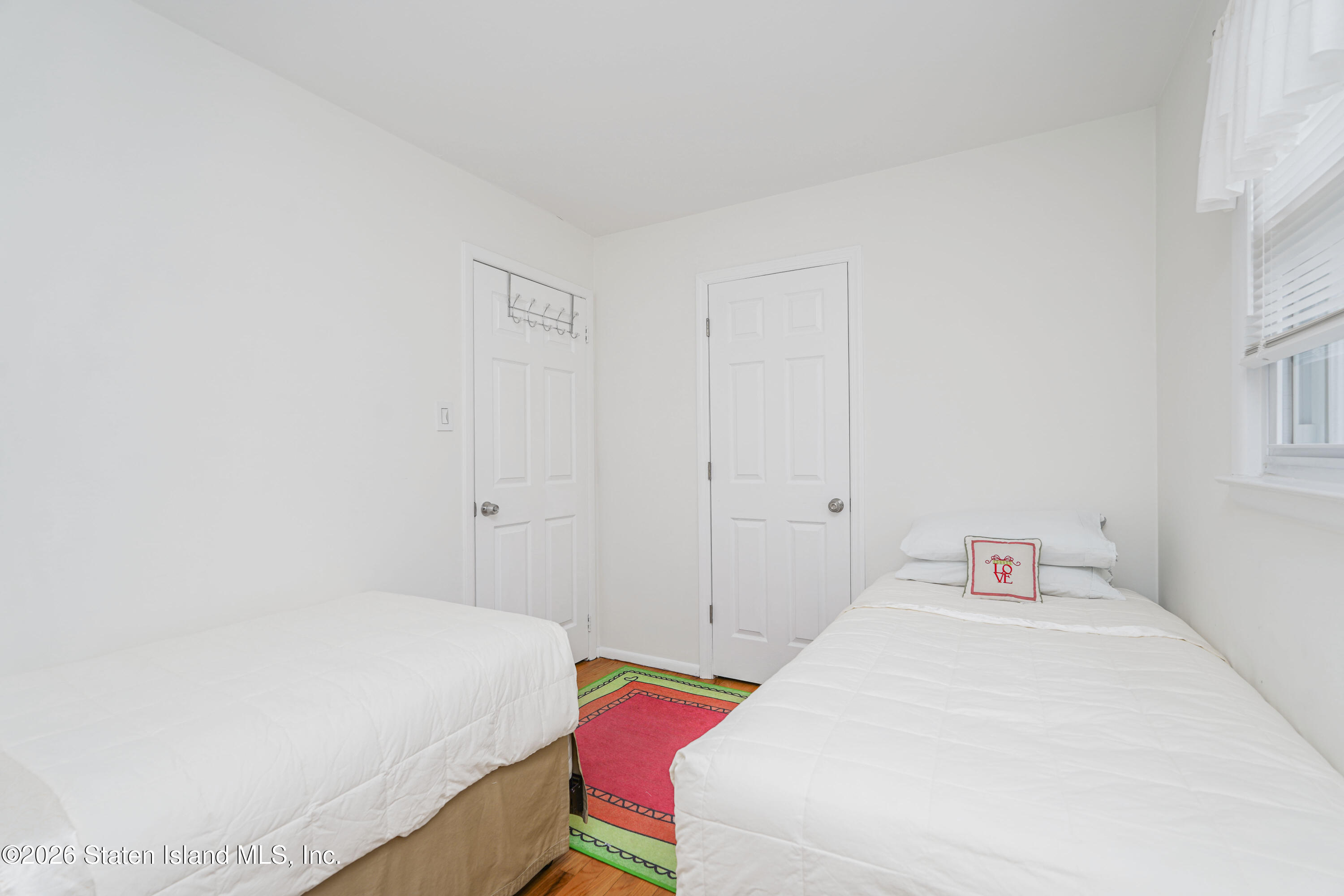 7750 Amboy Road Staten Island, NY 10307 - Photo 25 of 29 a bedroom with a bed and a window