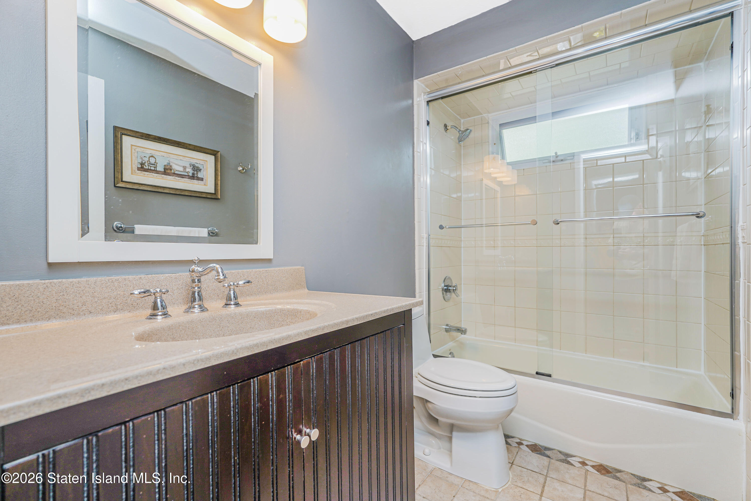 7750 Amboy Road Staten Island, NY 10307 - Photo 26 of 29 a bathroom with a sink a toilet and shower