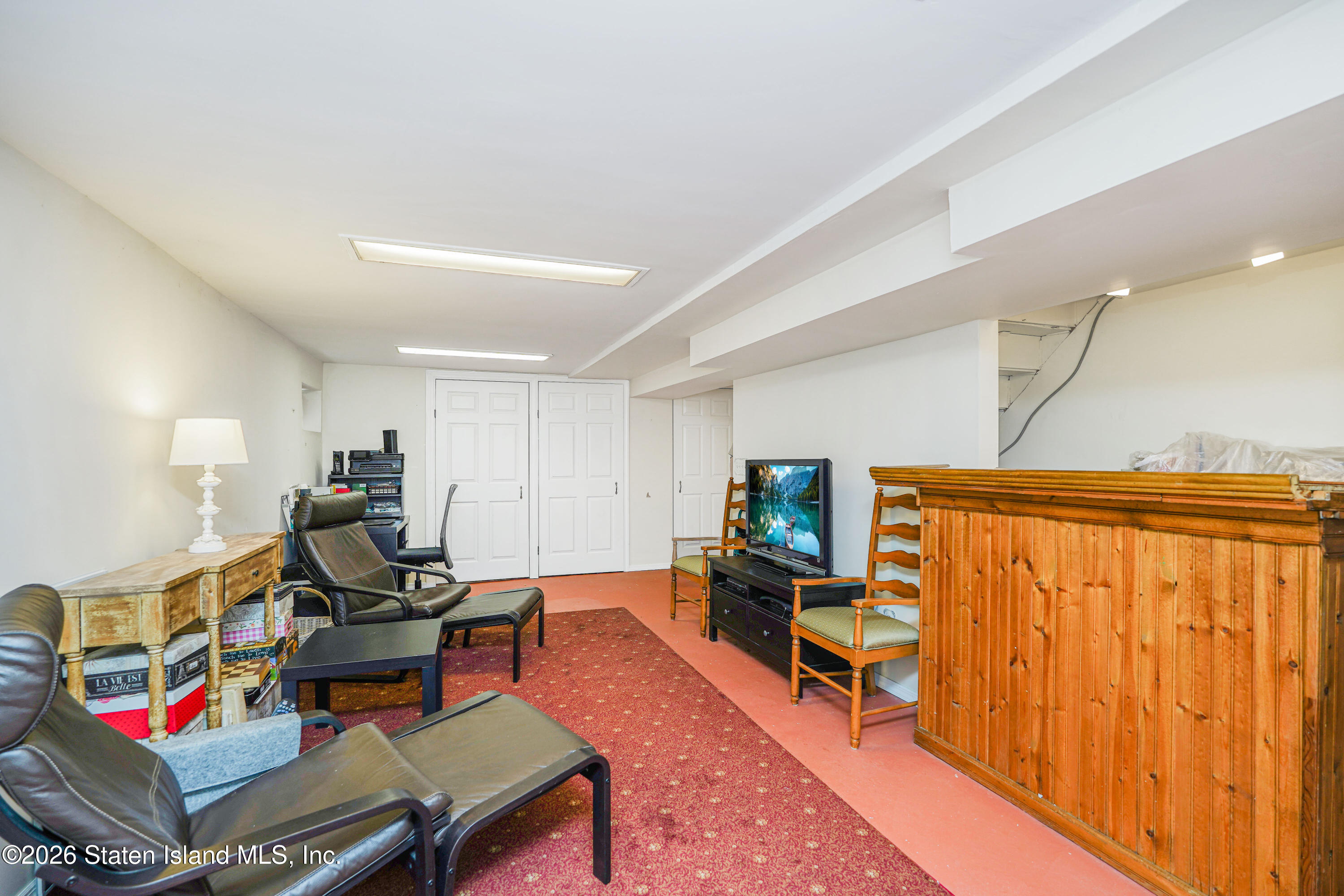 7750 Amboy Road Staten Island, NY 10307 - Photo 27 of 29 a living room with furniture and a flat screen tv