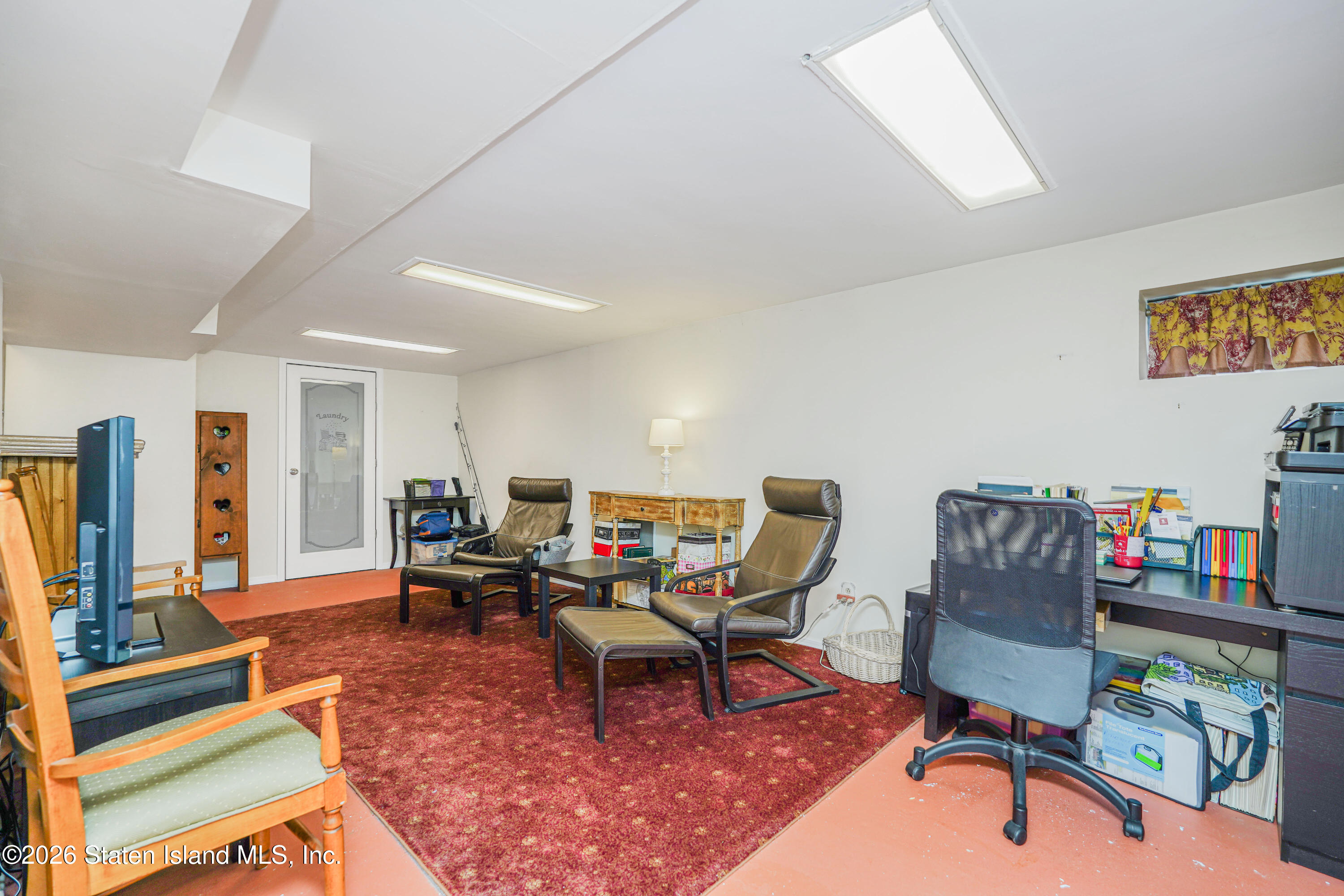 7750 Amboy Road Staten Island, NY 10307 - Photo 28 of 29 a living room with furniture and a rug