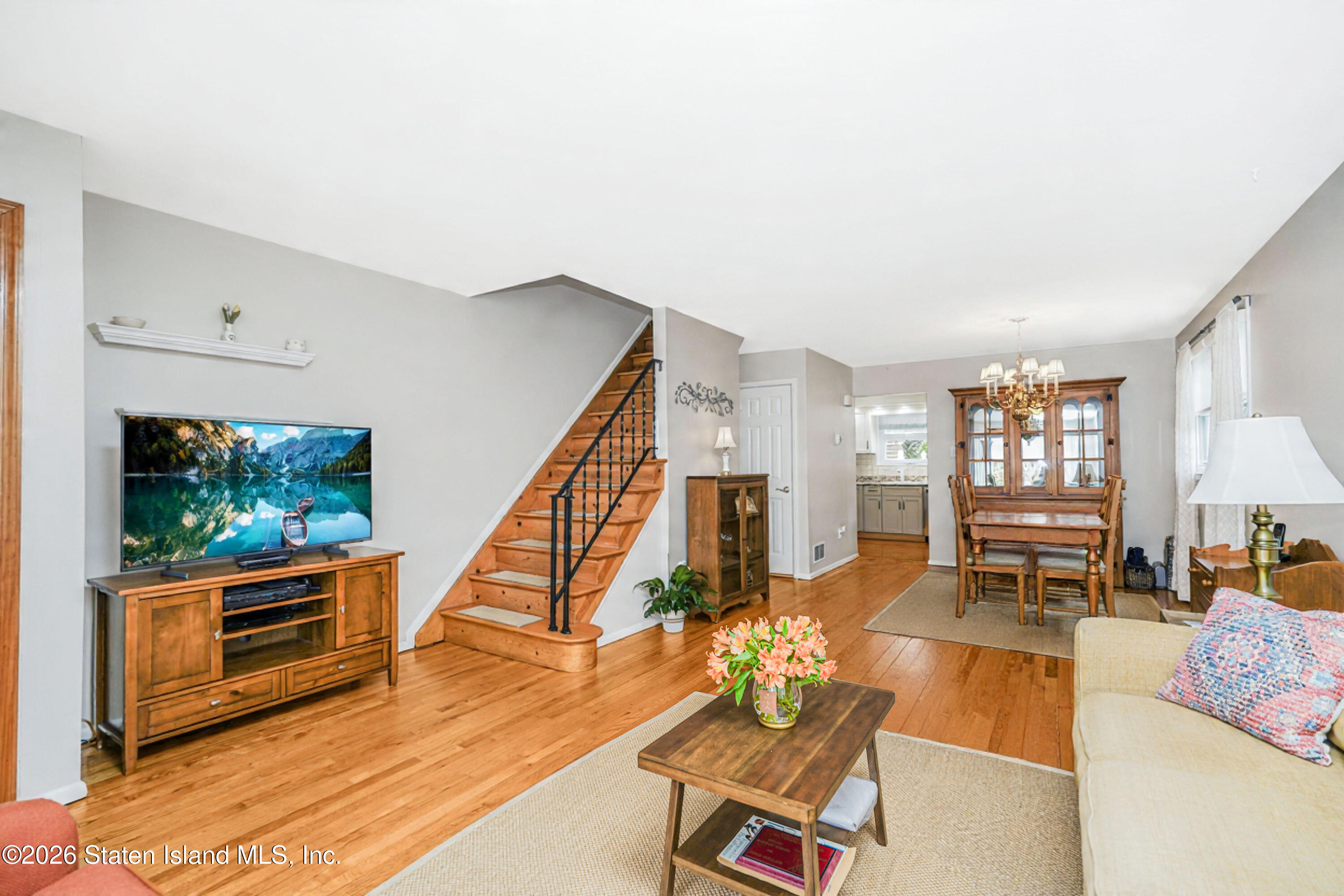 7750 Amboy Road Staten Island, NY 10307 - Photo 3 of 29 a living room with furniture and a flat screen tv