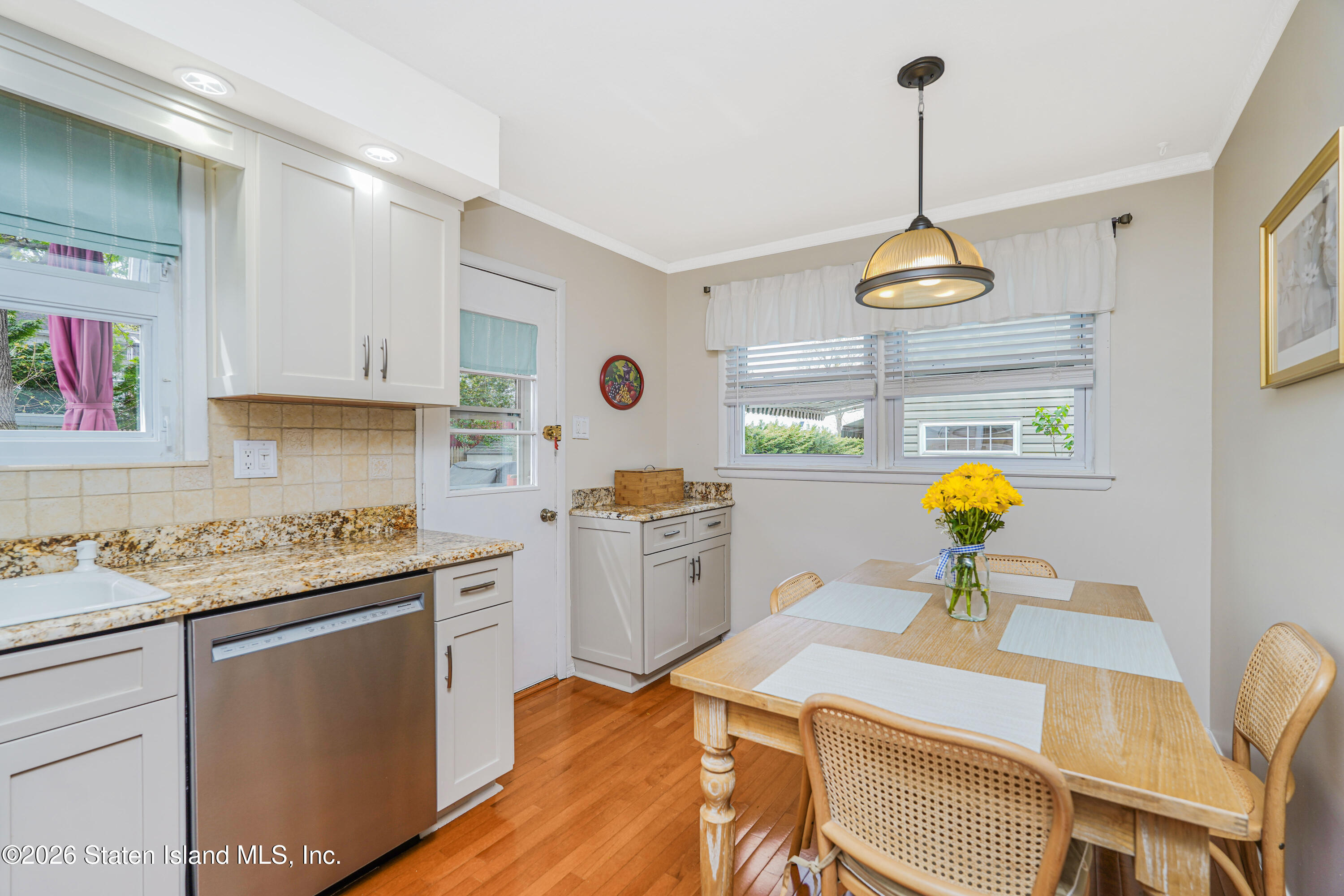 7750 Amboy Road Staten Island, NY 10307 - Photo 9 of 29 a kitchen with a sink appliances and cabinets