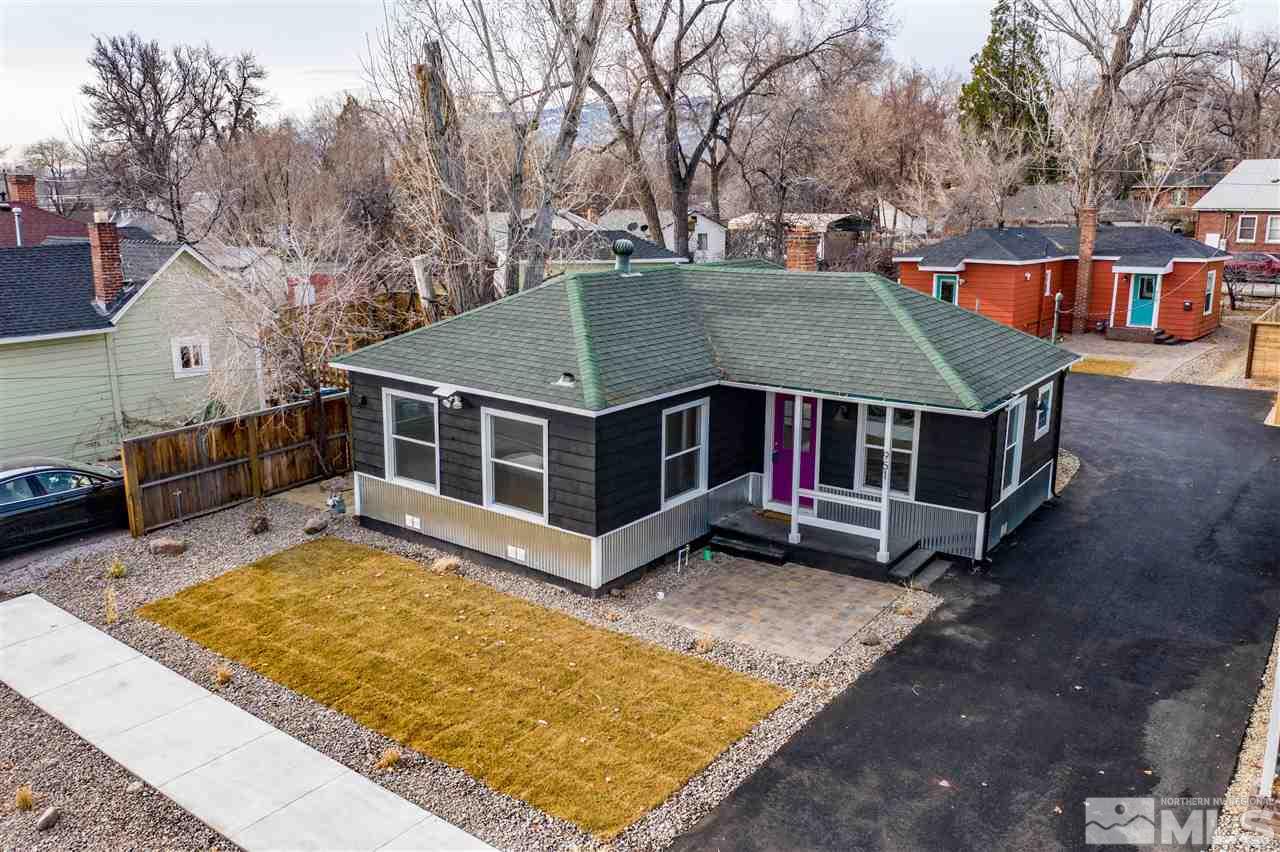 951 Watt Street Reno, NV 89509 - Photo 1 of 11 a view of a house with a large tree and a yard