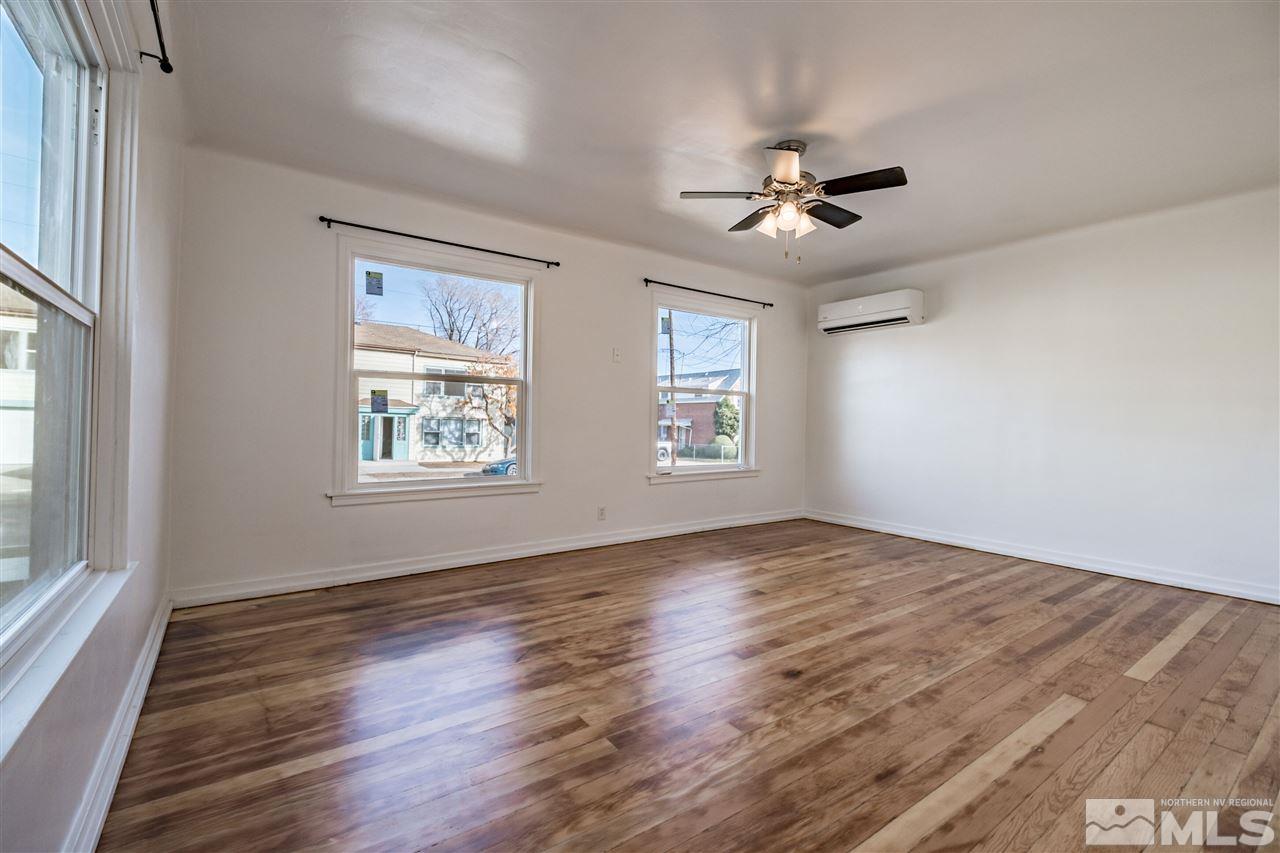 951 Watt Street Reno, NV 89509 - Photo 6 of 11 wooden floor in an empty room with a window