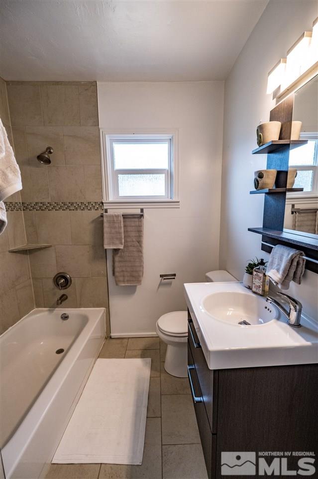 951 Watt Street Reno, NV 89509 - Photo 8 of 11 a bathroom with a sink a toilet and shower