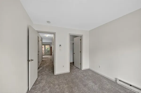 an empty room with mirror in it