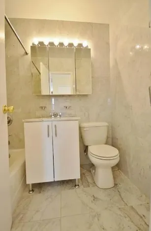 a bedroom with bed and a window