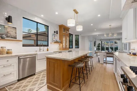 a kitchen with a washer and dryer in it