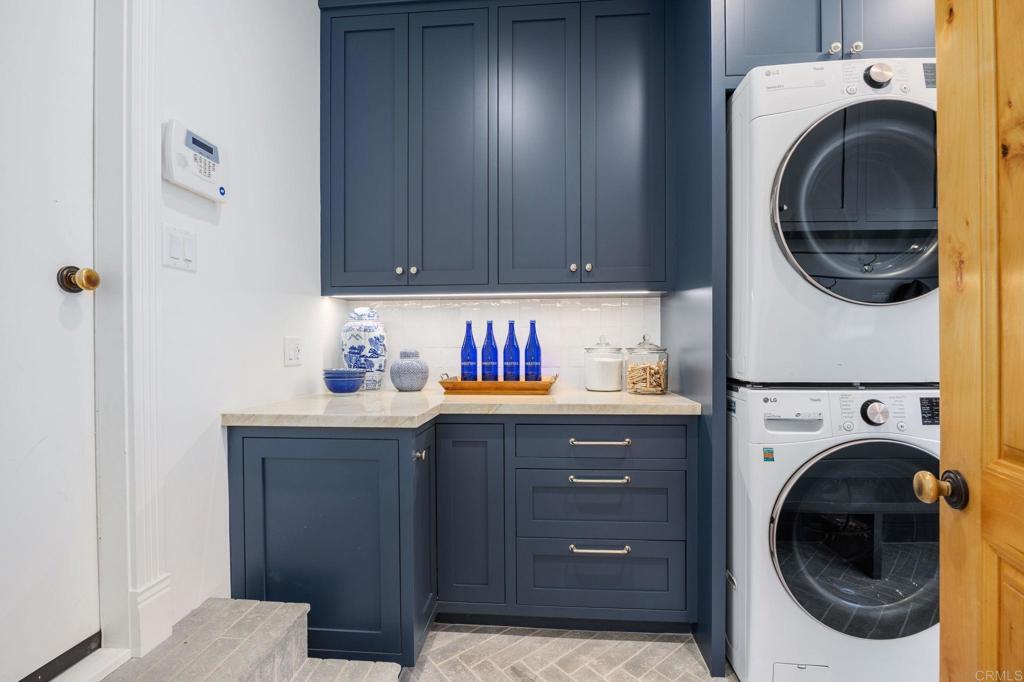 371 La Mesa Avenue Encinitas, CA 92024 - Photo 12 of 30 a kitchen with a washer and dryer in it