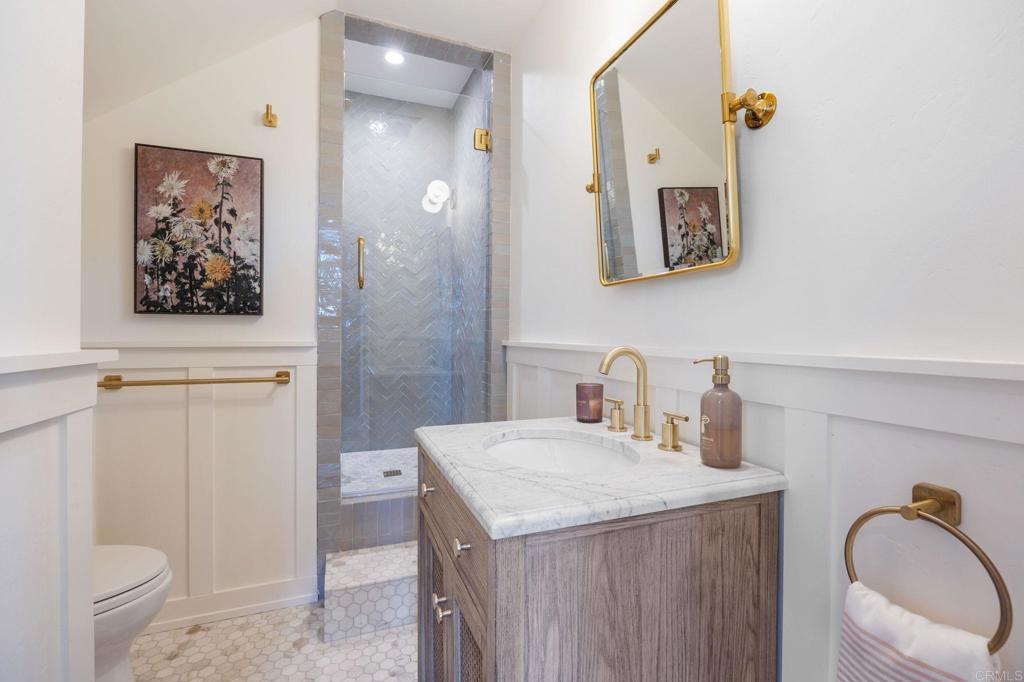 371 La Mesa Avenue Encinitas, CA 92024 - Photo 14 of 30 a bathroom with a granite countertop sink mirror vanity and toilet