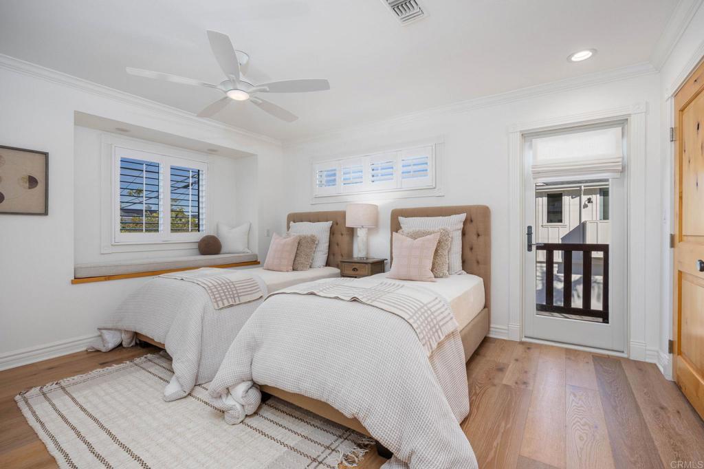 371 La Mesa Avenue Encinitas, CA 92024 - Photo 21 of 30 a bedroom with a large bed and a window