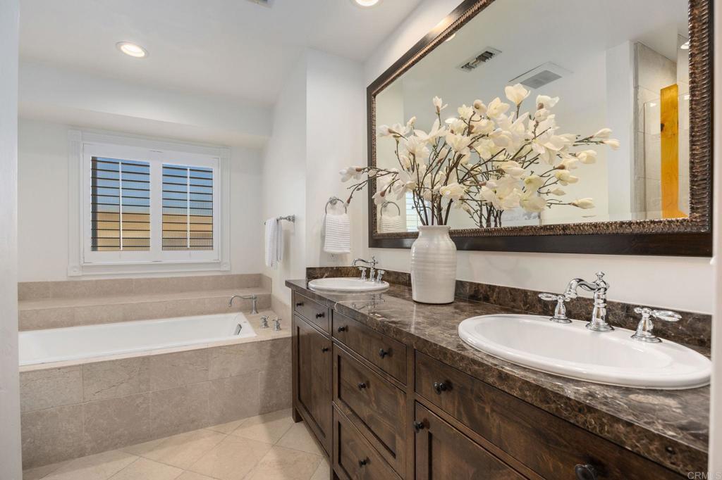 371 La Mesa Avenue Encinitas, CA 92024 - Photo 22 of 30 a bathroom with a tub sink and mirror