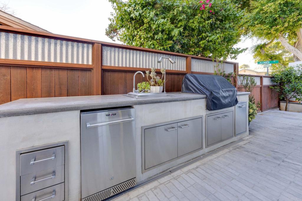 371 La Mesa Avenue Encinitas, CA 92024 - Photo 24 of 30 a kitchen with a sink and cabinets