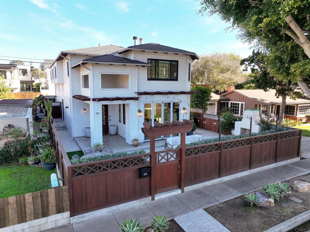 371 La Mesa Avenue Encinitas, CA 92024 - Photo 28 of 30 a front view of a house with garden