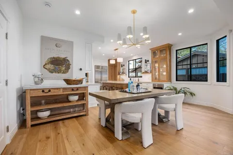 a kitchen with stainless steel appliances kitchen island granite countertop a sink and cabinets