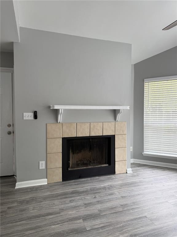 105 Hawkstone Way Alpharetta, GA 30022 - Photo 6 of 23 a view of an empty room with wooden floor fireplace and a window