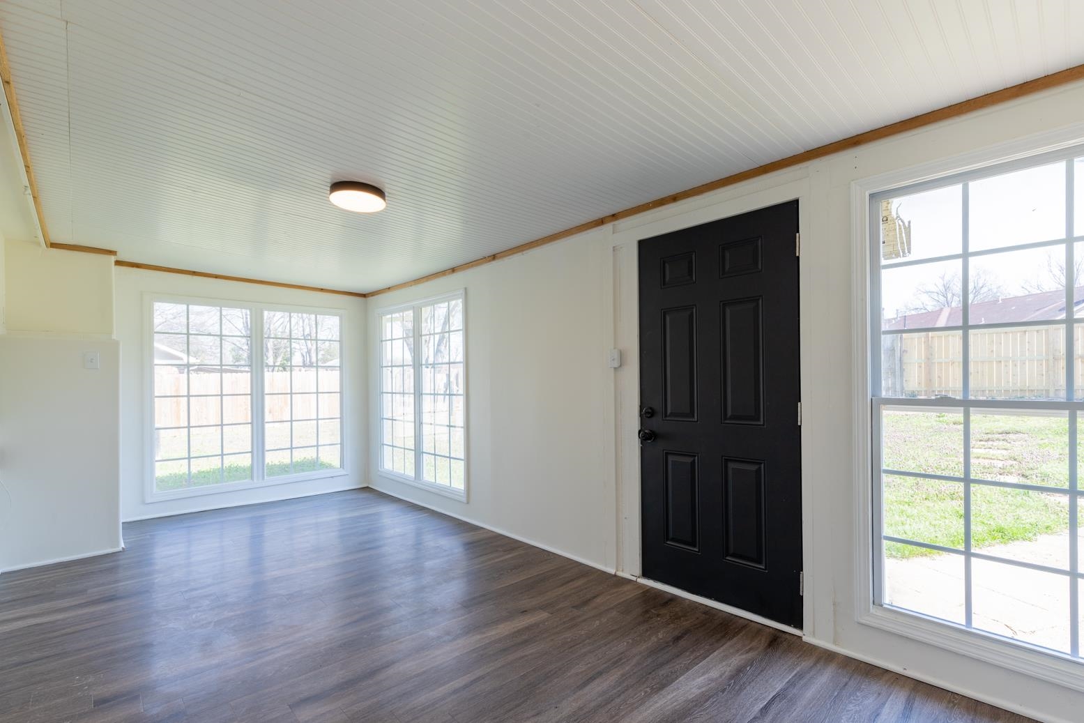 3268 Altruria Road Bartlett, TN 38134 - Photo 13 of 25 an empty room with wooden floor and windows