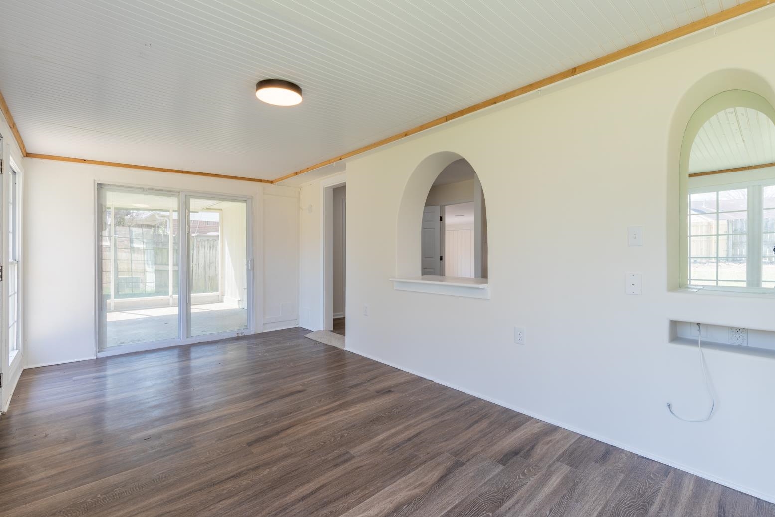 3268 Altruria Road Bartlett, TN 38134 - Photo 14 of 25 a view of an empty room with wooden floor and a window