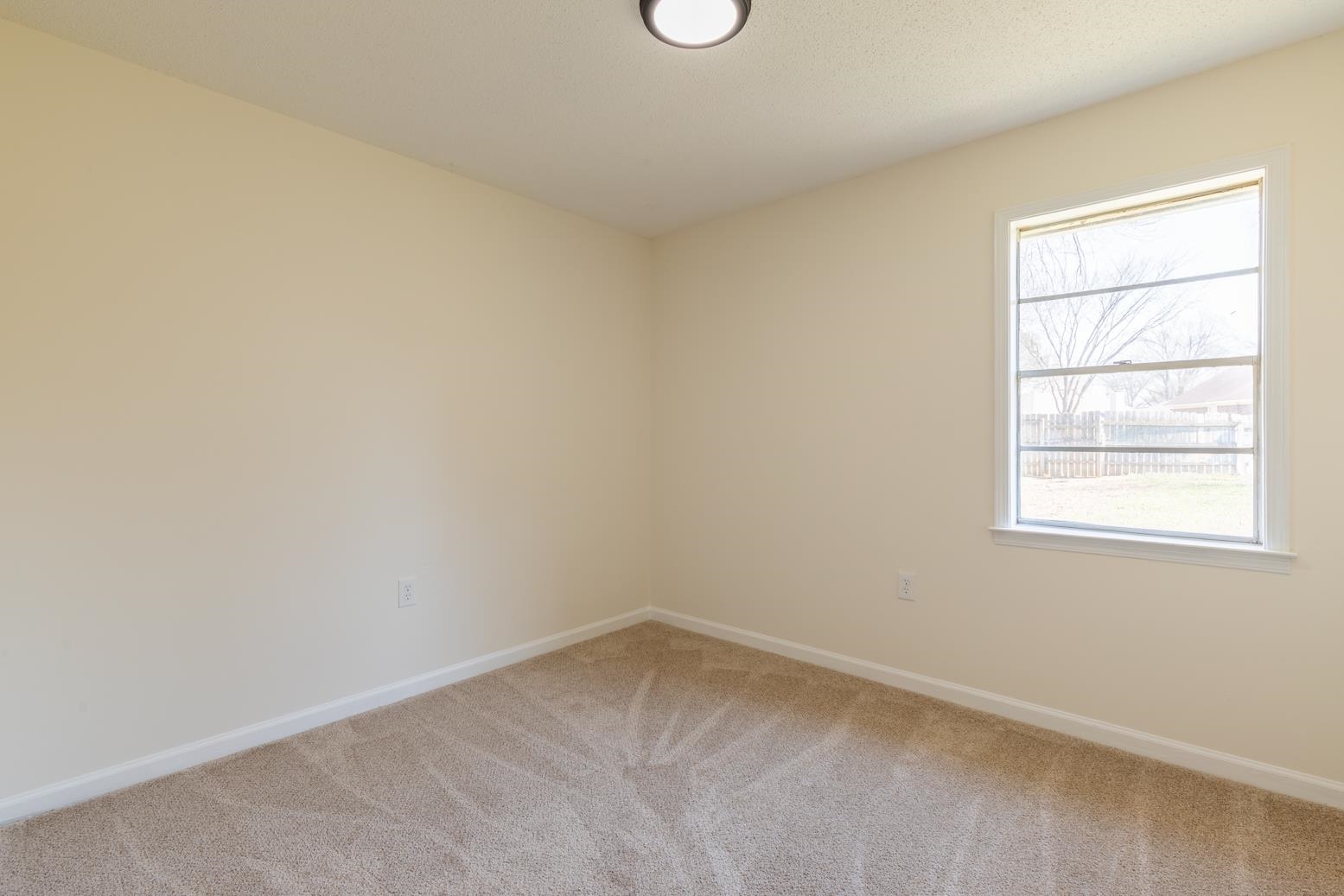 3268 Altruria Road Bartlett, TN 38134 - Photo 19 of 25 an empty room with a window