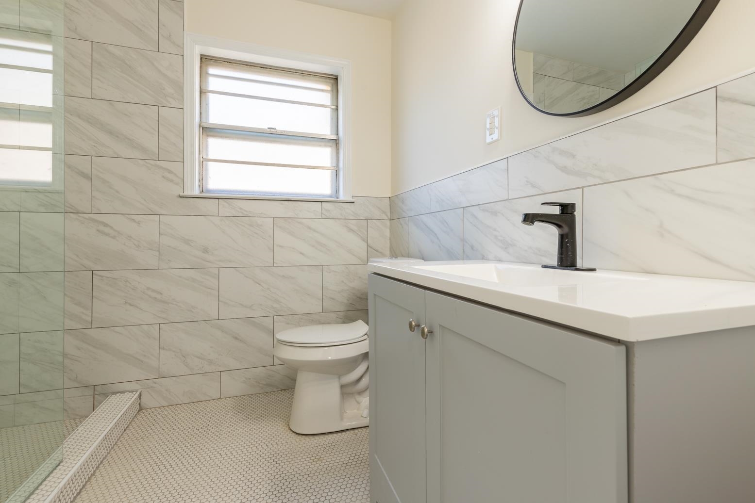 3268 Altruria Road Bartlett, TN 38134 - Photo 20 of 25 a bathroom with a sink toilet and a mirror