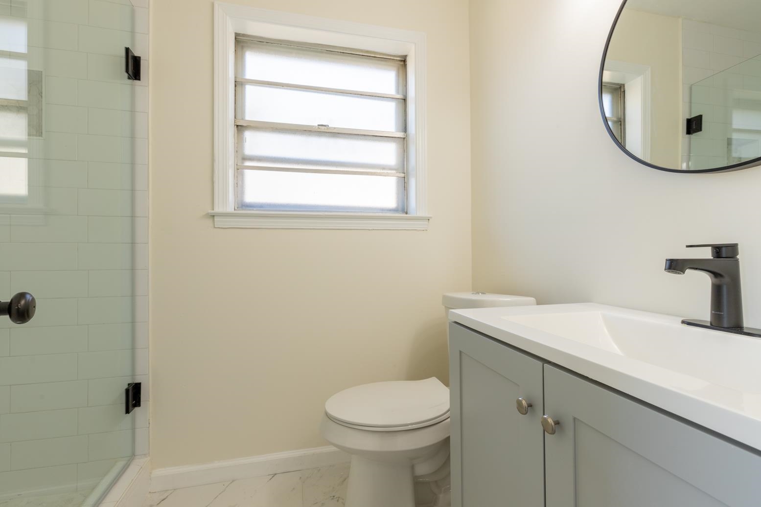 3268 Altruria Road Bartlett, TN 38134 - Photo 22 of 25 a bathroom with a toilet sink and mirror