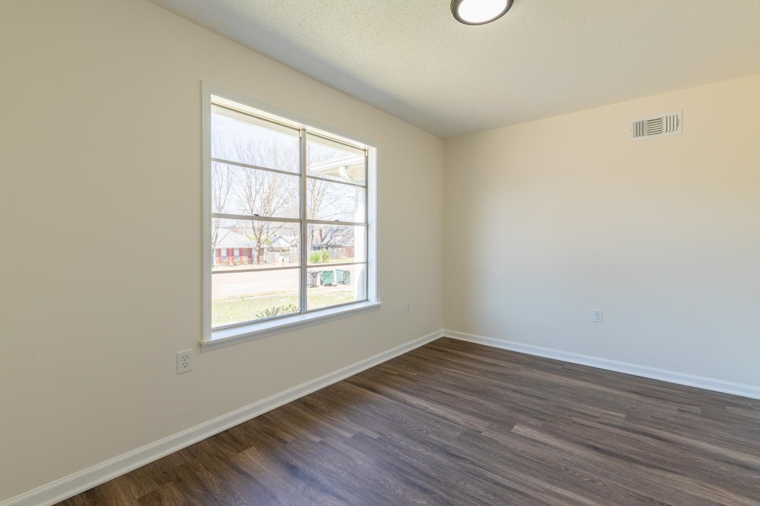 3268 Altruria Road Bartlett, TN 38134 - Photo 4 of 25 an empty room with wooden floor and windows